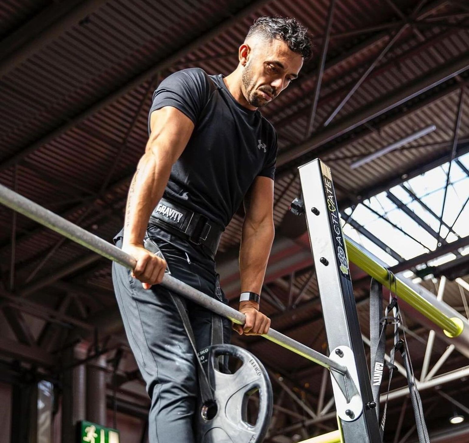 Lucas Rosemin, head coach of Cali Fit, doing a muscle up